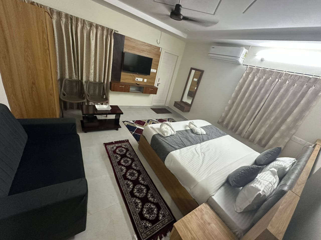 Spacious guest room at Hotel Dharani Grand KPHB